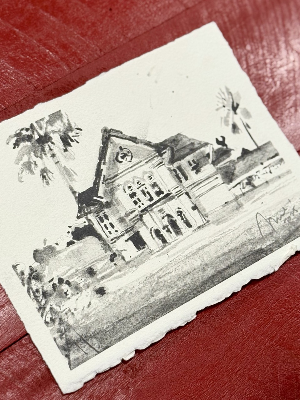 Sketcher holding artwork of Old Town